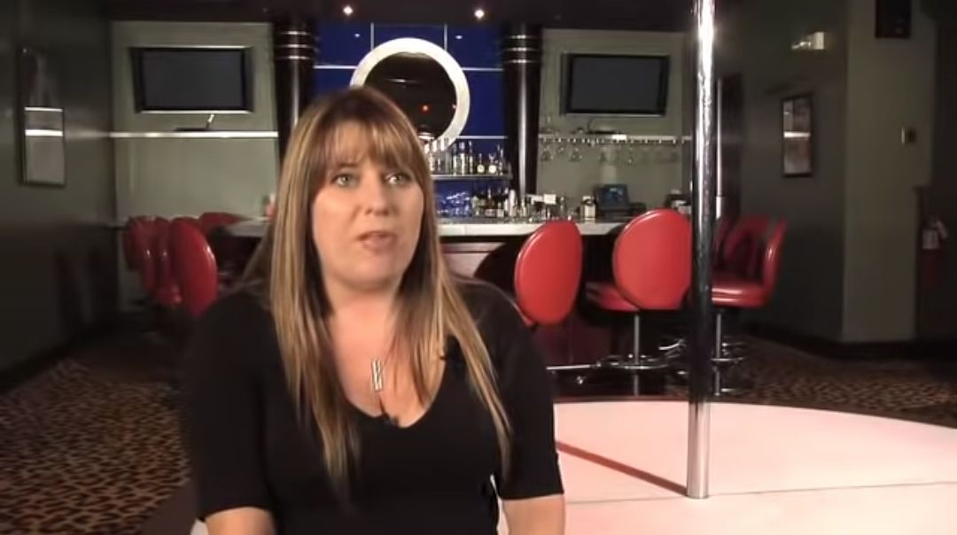 woman in front of a bar